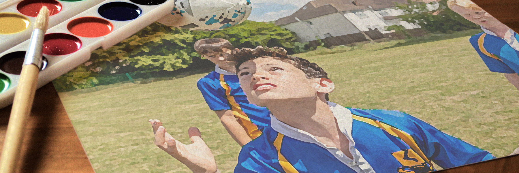painted image of student heading football