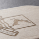 mockup of verulam logo laser-etched into wooden pencil case