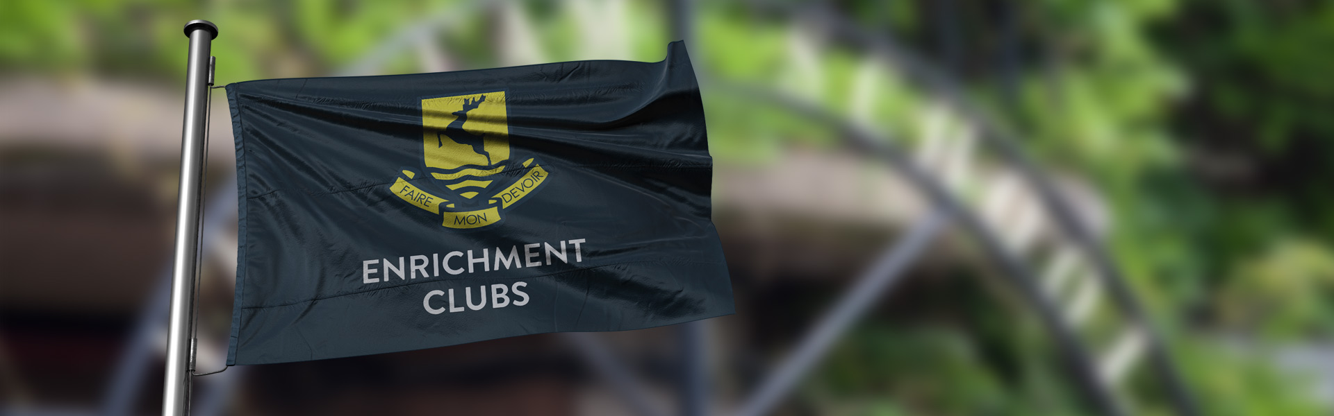 dark blue flag waving in the wind with verulam school logo and the words 'enrichment clubs'