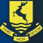 verulam school logo on blue background